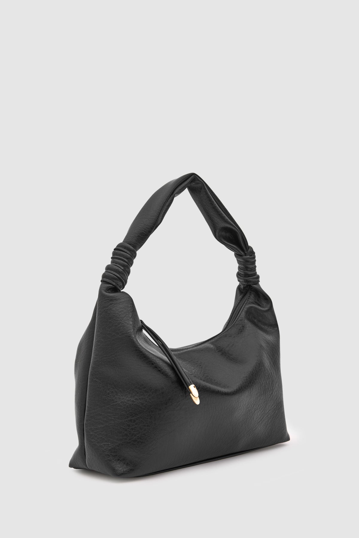 Munira Oval Shoulder Bag in black, view 2 – Nouva