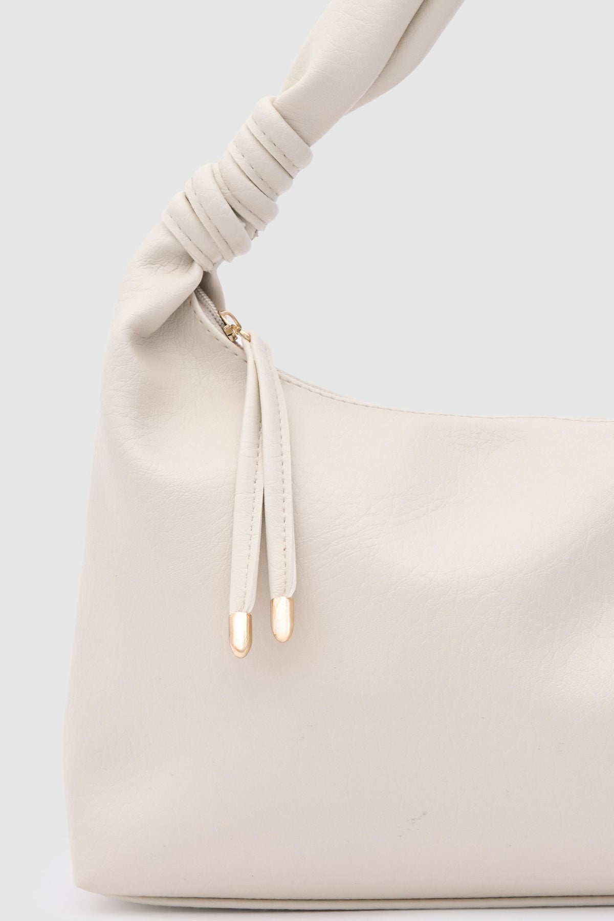 Munira Oval Shoulder Bag in cream, view 4 – Nouva