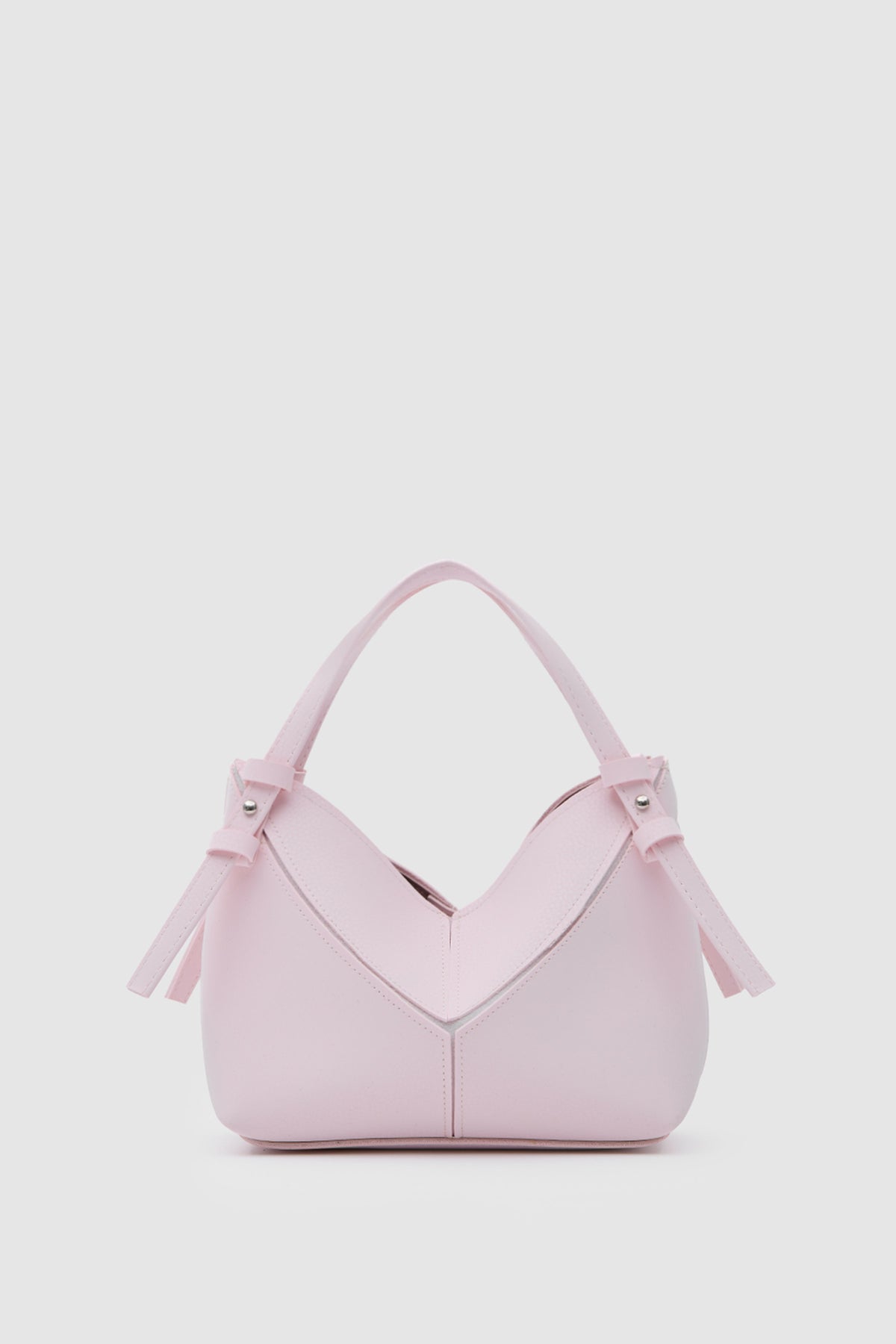 Simak Asymmetric Charm Crossbody Bag in sakura pink – women's crossbody bag by Nouva