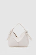 Simak Asymmetric Charm Crossbody Bag in vanilla – women's crossbody bag by Nouva