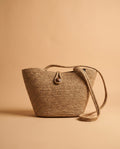 Deneb Buttoned Straw Shoulder Bag in taupe, front view with woven straw-effect texture and button closure – women's shoulder bag by Nouva