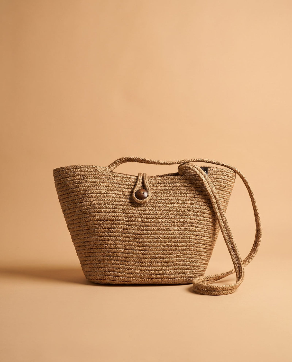 Deneb Buttoned Straw Shoulder Bag in taupe, front view with woven straw-effect texture and button closure – women's shoulder bag by Nouva